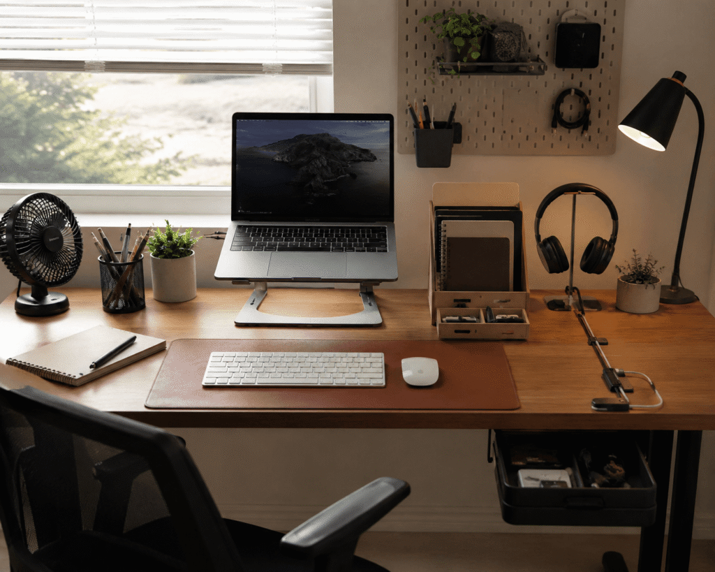 Small home office desk setup with affordable desk accessories, laptop stand, desk lamp, organizer, desk mat and cable management